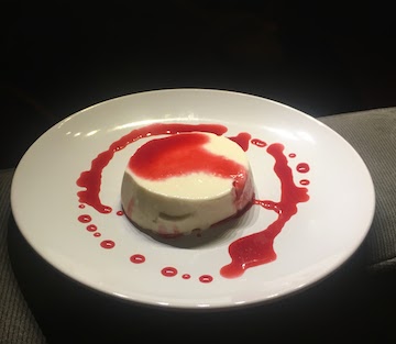 Panna Cotta with a raspberry reduction sauce